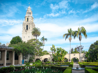 A Large Clock Tower In Front Of Balboa Park
